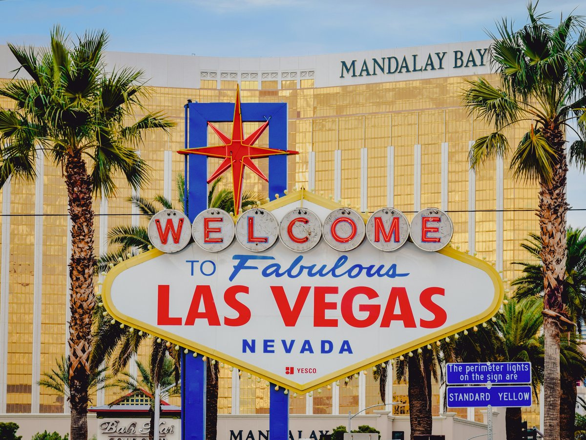 a welcome sign in front of a hotel