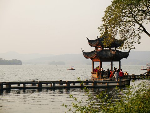 people on brown wooden dock during daytime
