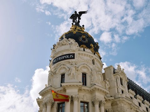 a large building with a statue on top of it