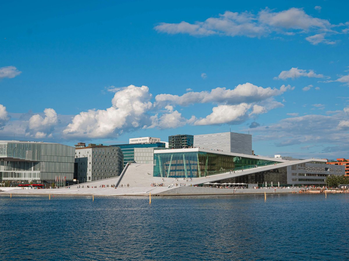 a body of water with buildings in the background