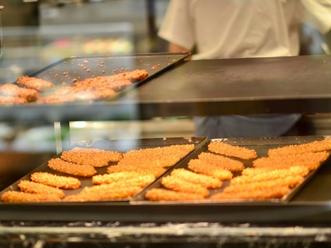 a person making food in a kitchen