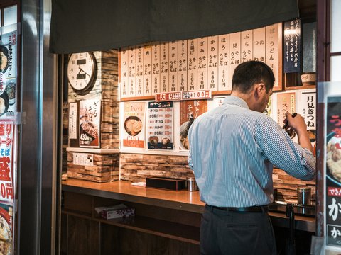 A man ordering food in a restaurant.