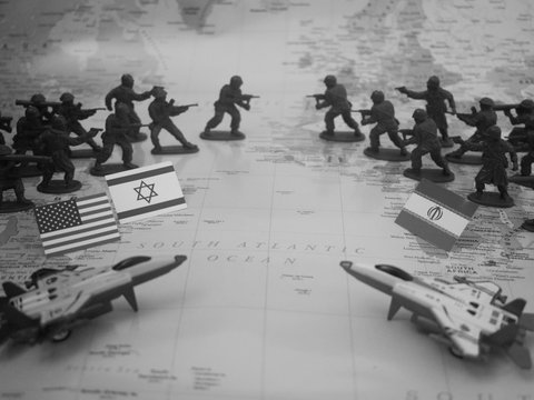Toy soldiers and jets arranged on a map