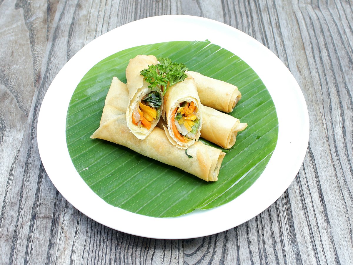 a plate of food on a wooden table