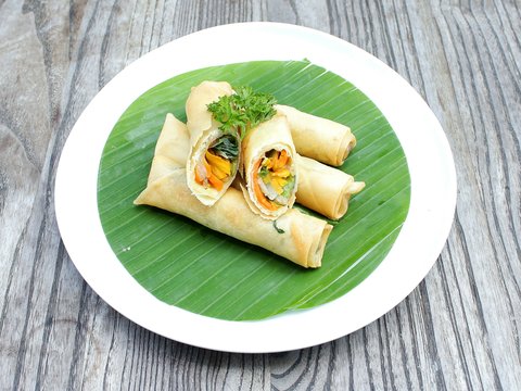 a plate of food on a wooden table