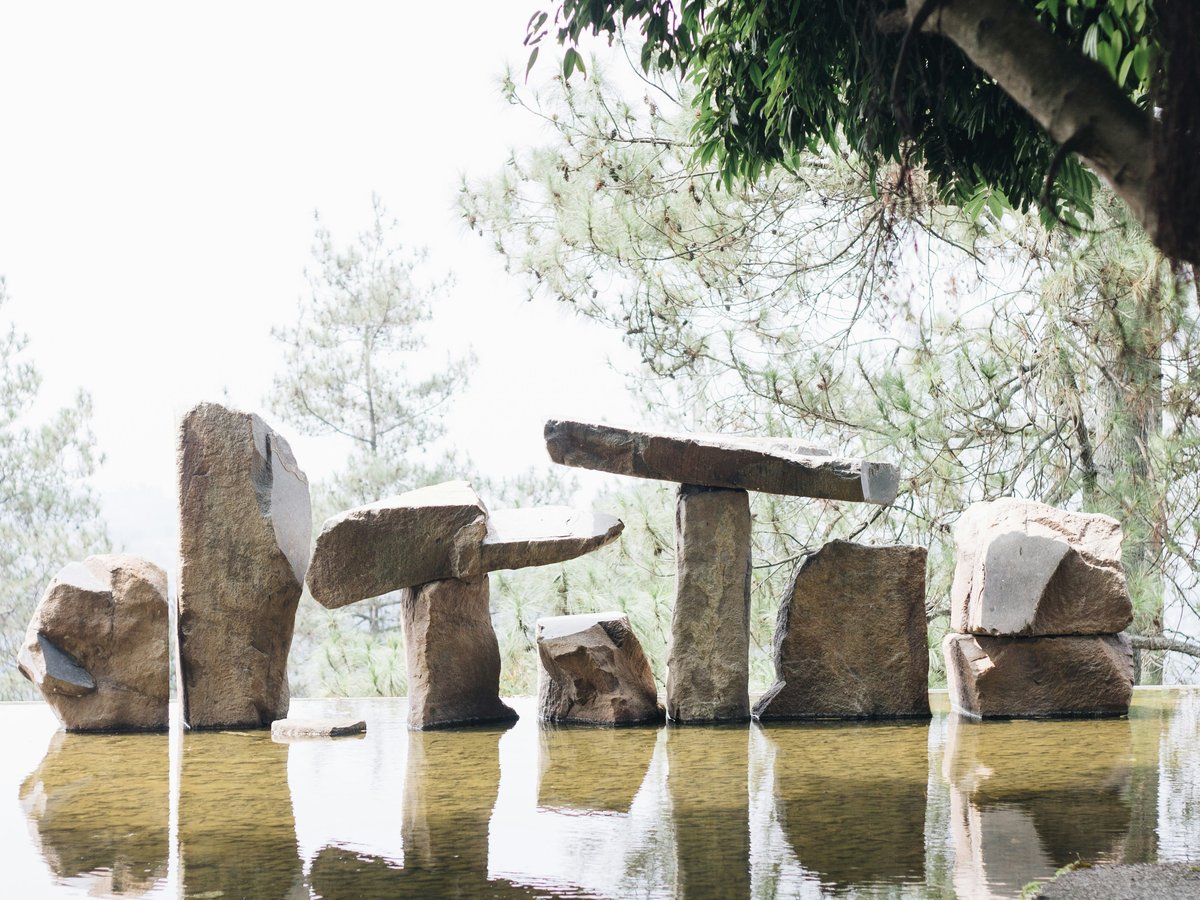 brown stone near body of water during daytime
