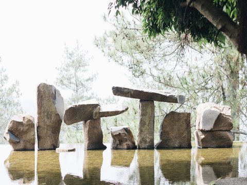 brown stone near body of water during daytime