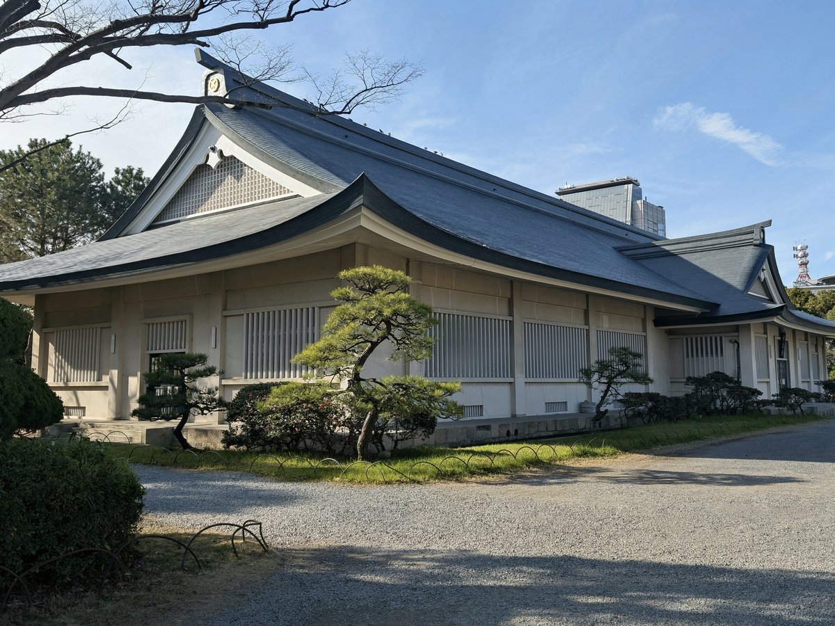 Traditional japanese building with manicured trees