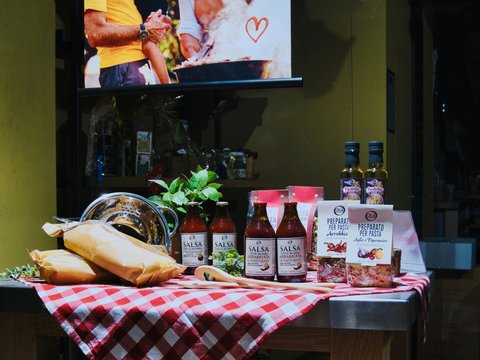 Food products displayed on a table with a checkered cloth.
