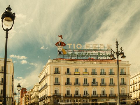 Vintage view of tio pepe building in a city square.