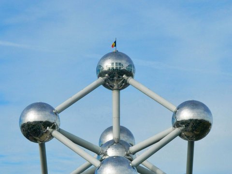 A large metal structure with four spheres on it