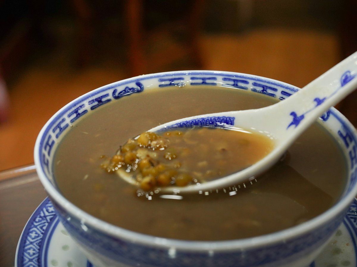 a bowl of soup with a spoon in it