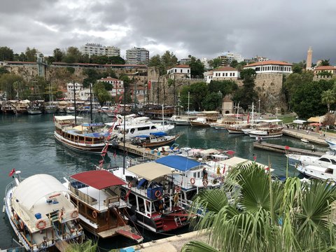 boat on dock near buildings during daytime