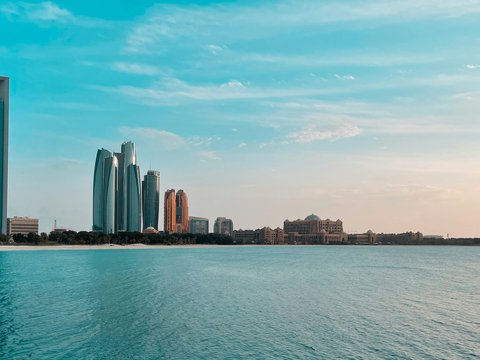 city skyline across body of water during daytime