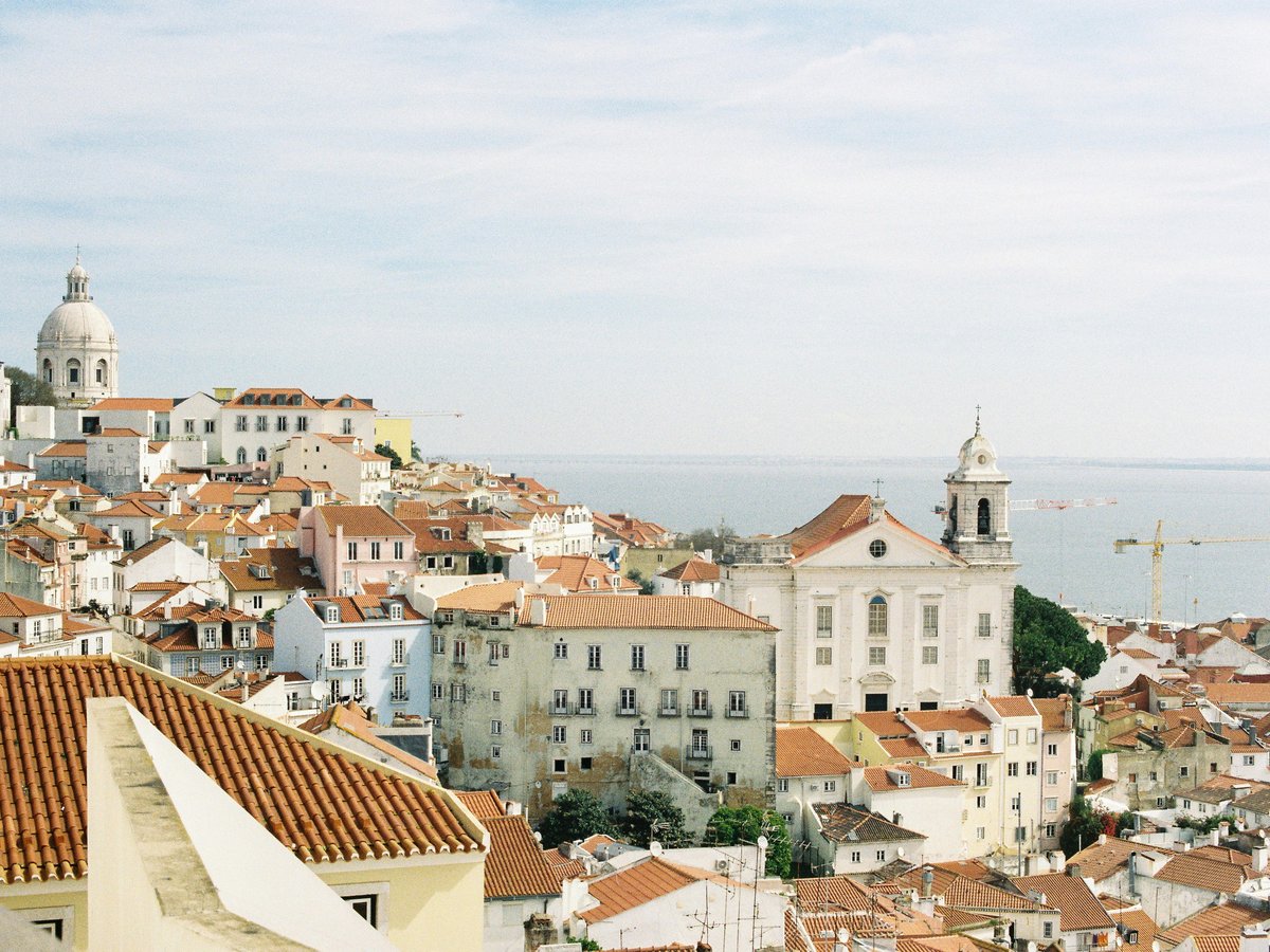 A view of a city from the top of a hill