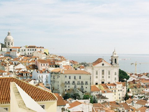 A view of a city from the top of a hill