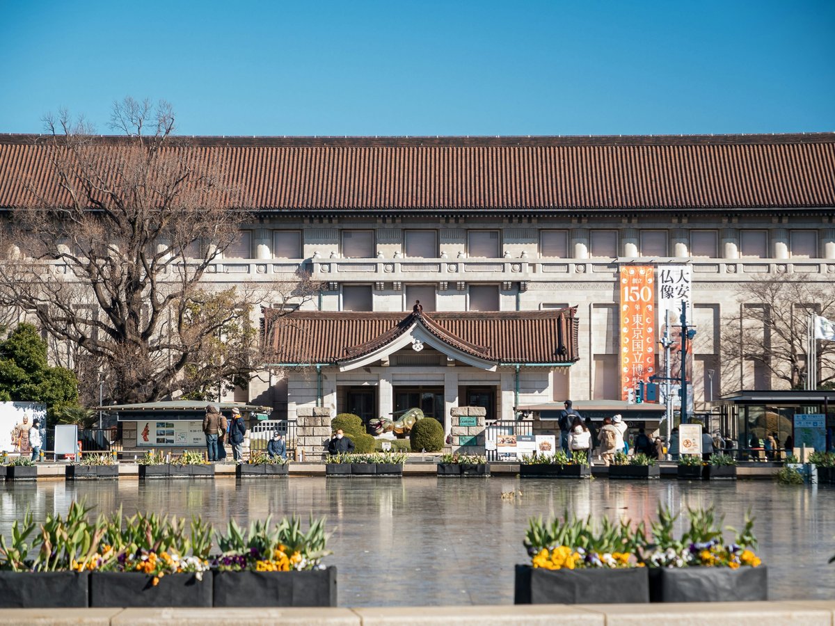 a building with a pond in front of it
