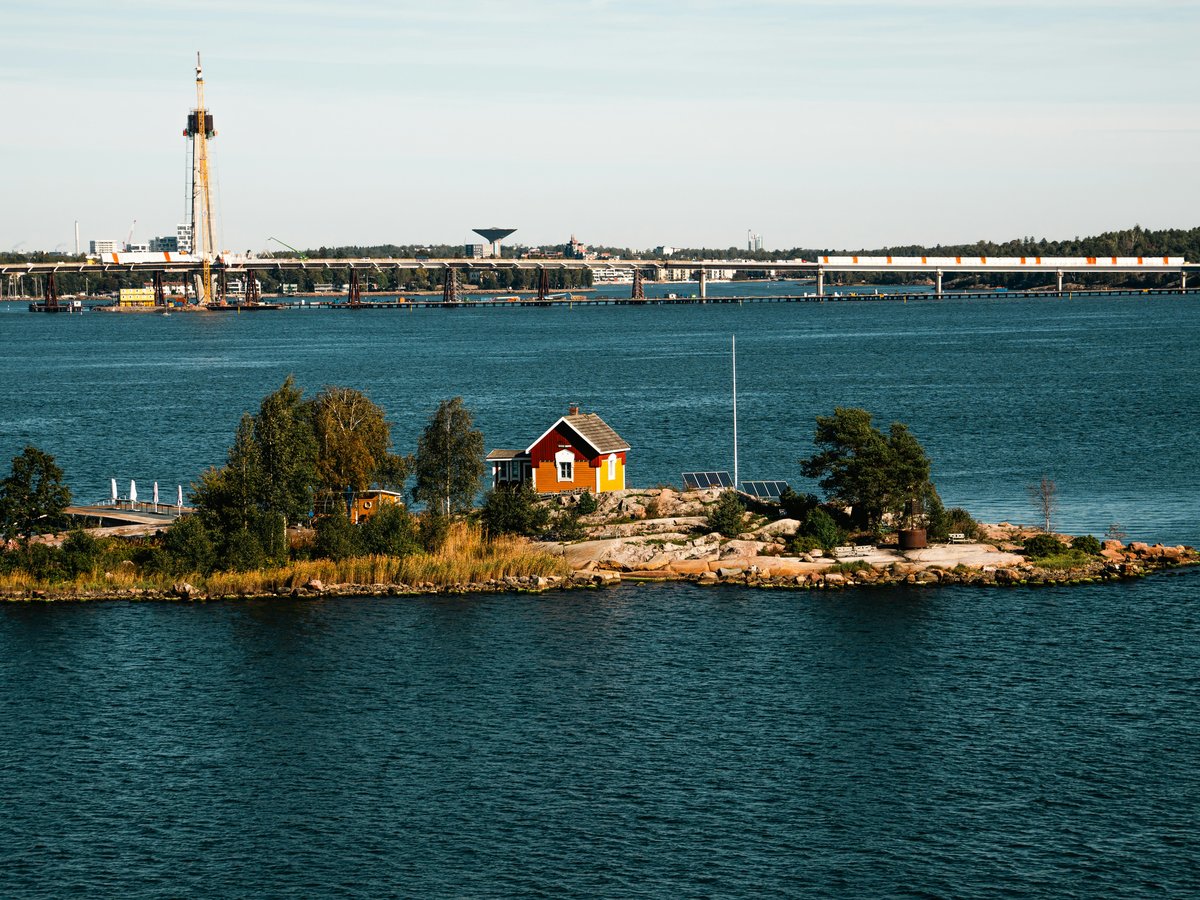 A small island in the middle of a large body of water