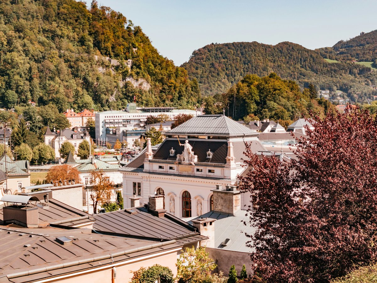 A scenic view of a town nestled between mountains.