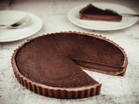 brown cake on white ceramic plate