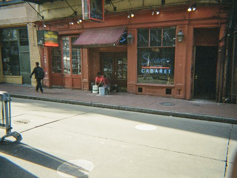 A red-fronted cabaret in a city street
