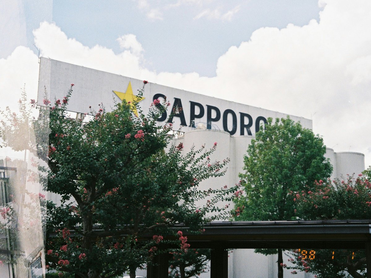 Sapporo building with trees and clouds