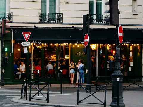 people standing near storefront