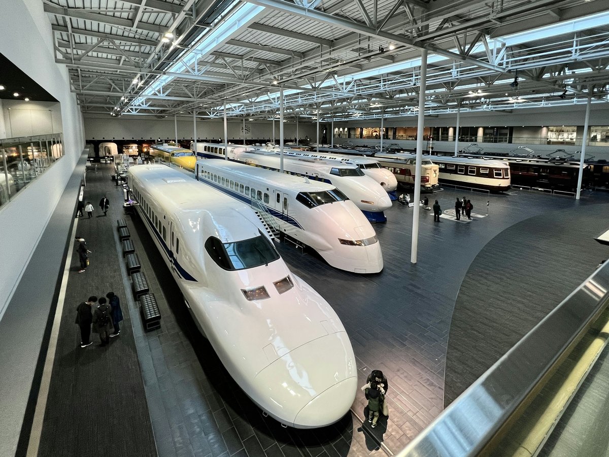 a couple of trains that are in a building