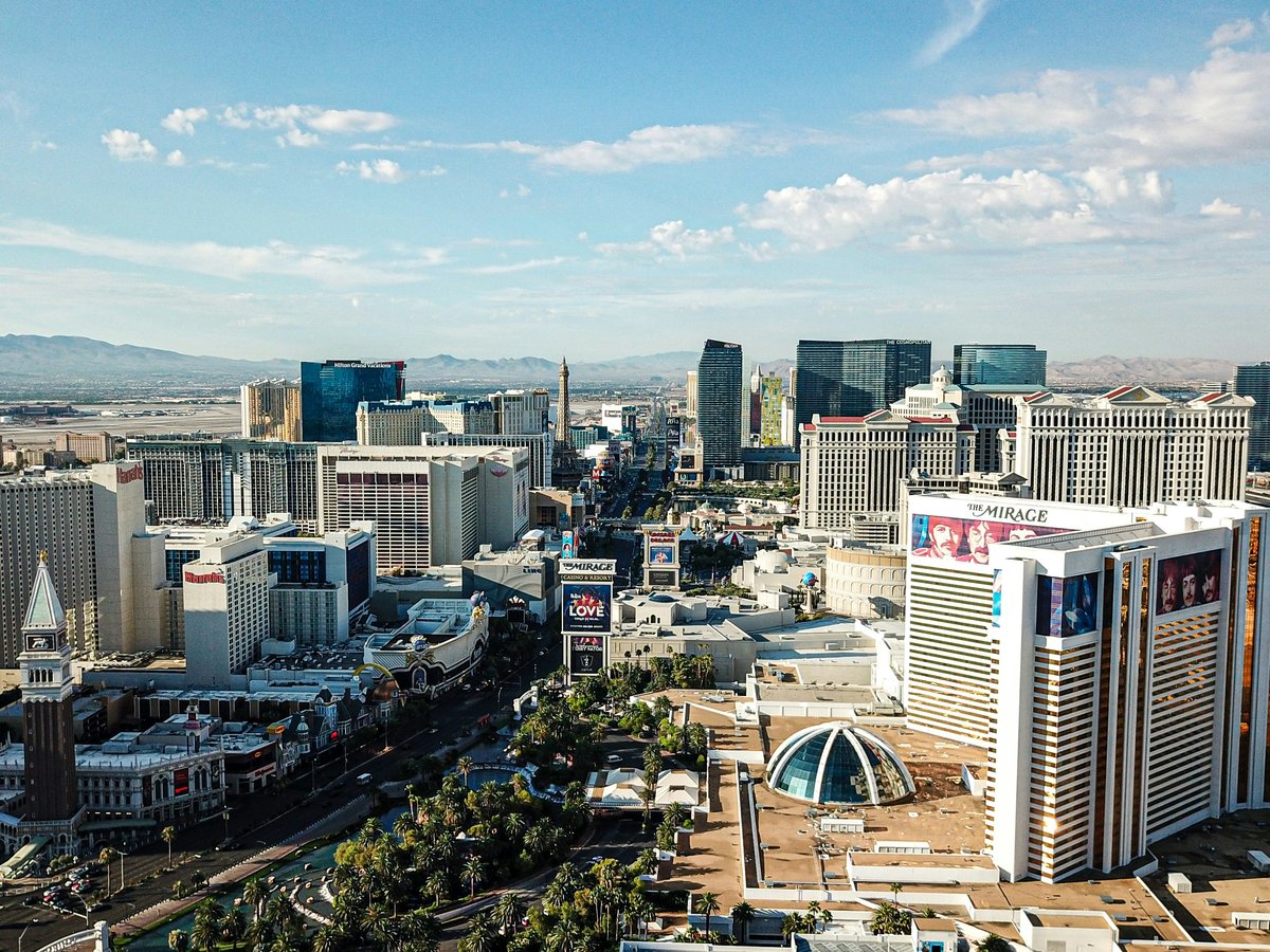 aerial photography of city with high-rise buildings under white and blue sky