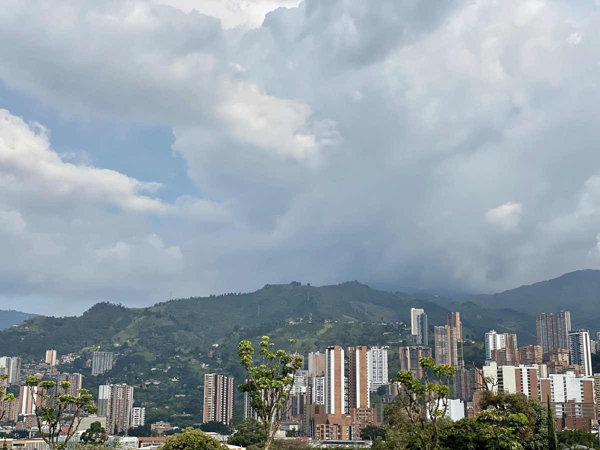 a view of a city with mountains in the background