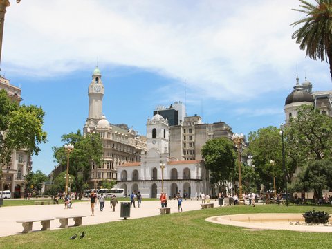 a large building with a dome and towers surrounded by trees