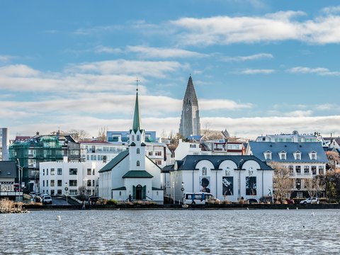a large body of water with a city in the background