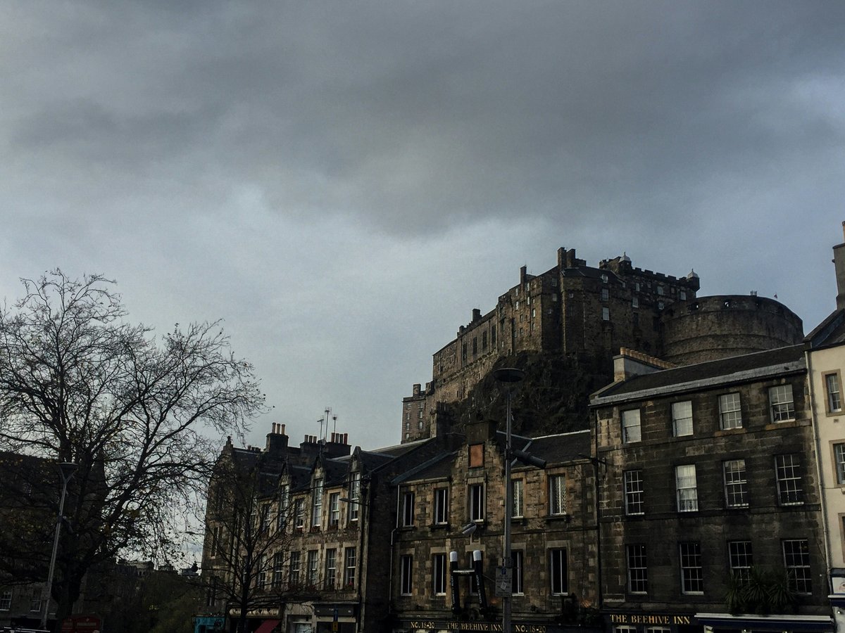 a large castle like building on a cloudy day