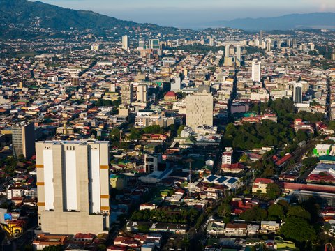 an aerial view of a city with tall buildings