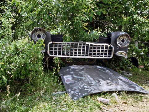 a car that is sitting in the grass