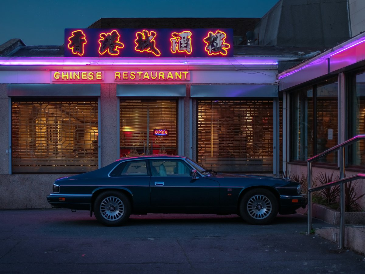 a car parked in front of a chinese restaurant