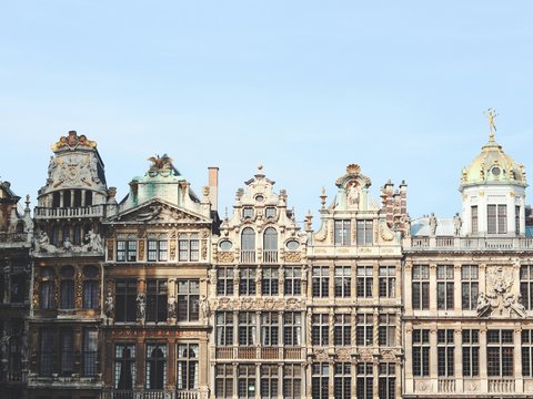 gray and brown building under blue sky