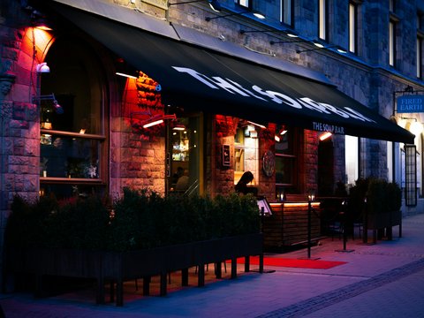 a restaurant on a city street at night