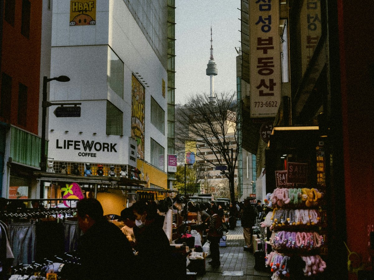 Street market with namsan tower in the distance.