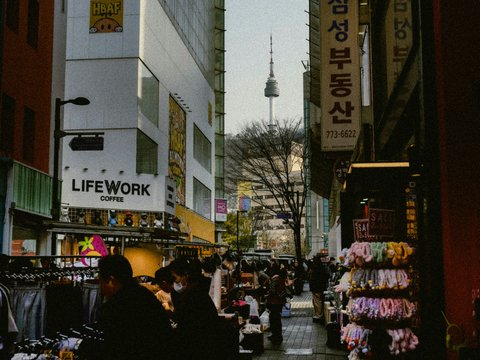 Street market with namsan tower in the distance.