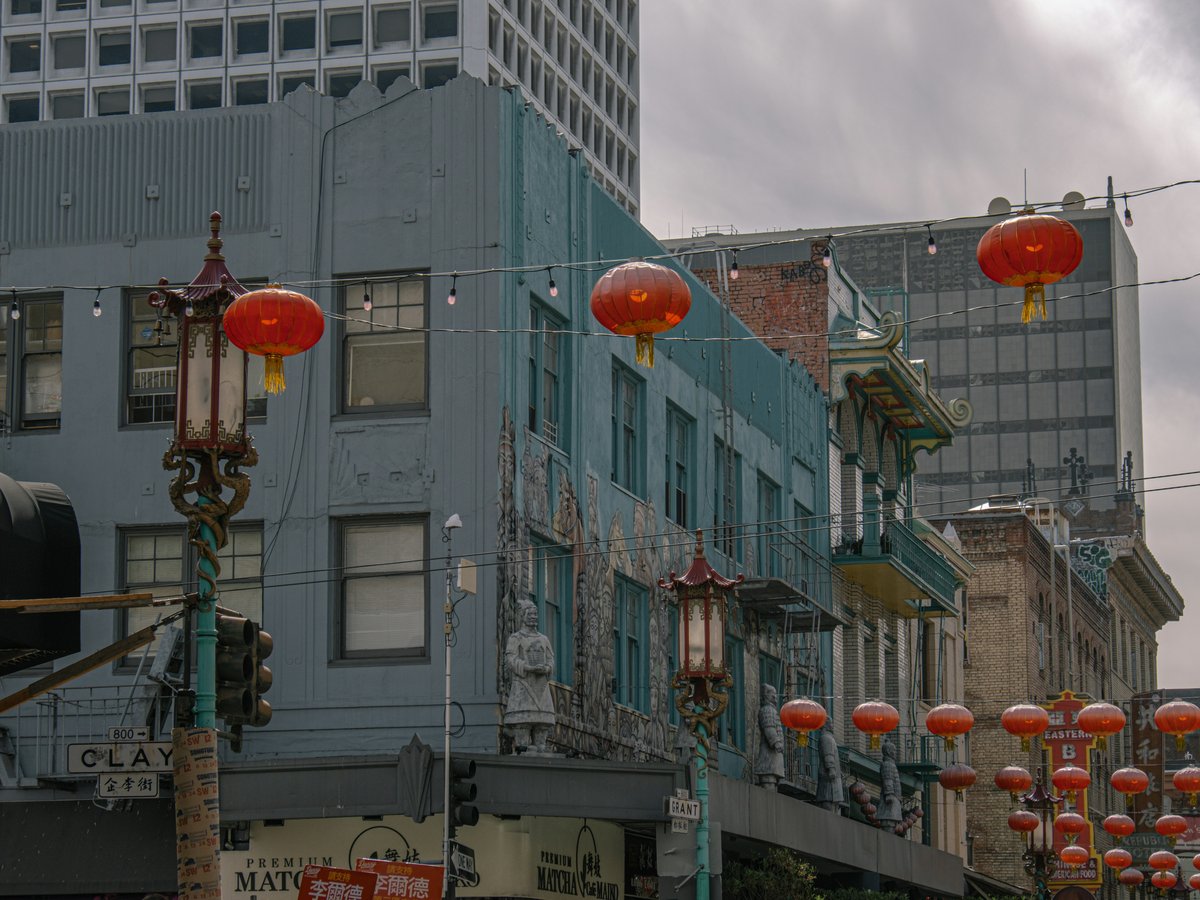 A city street filled with lots of red lanterns