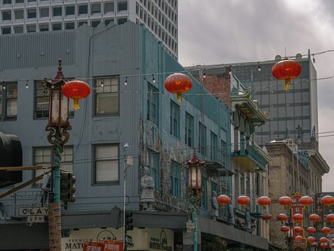 A city street filled with lots of red lanterns