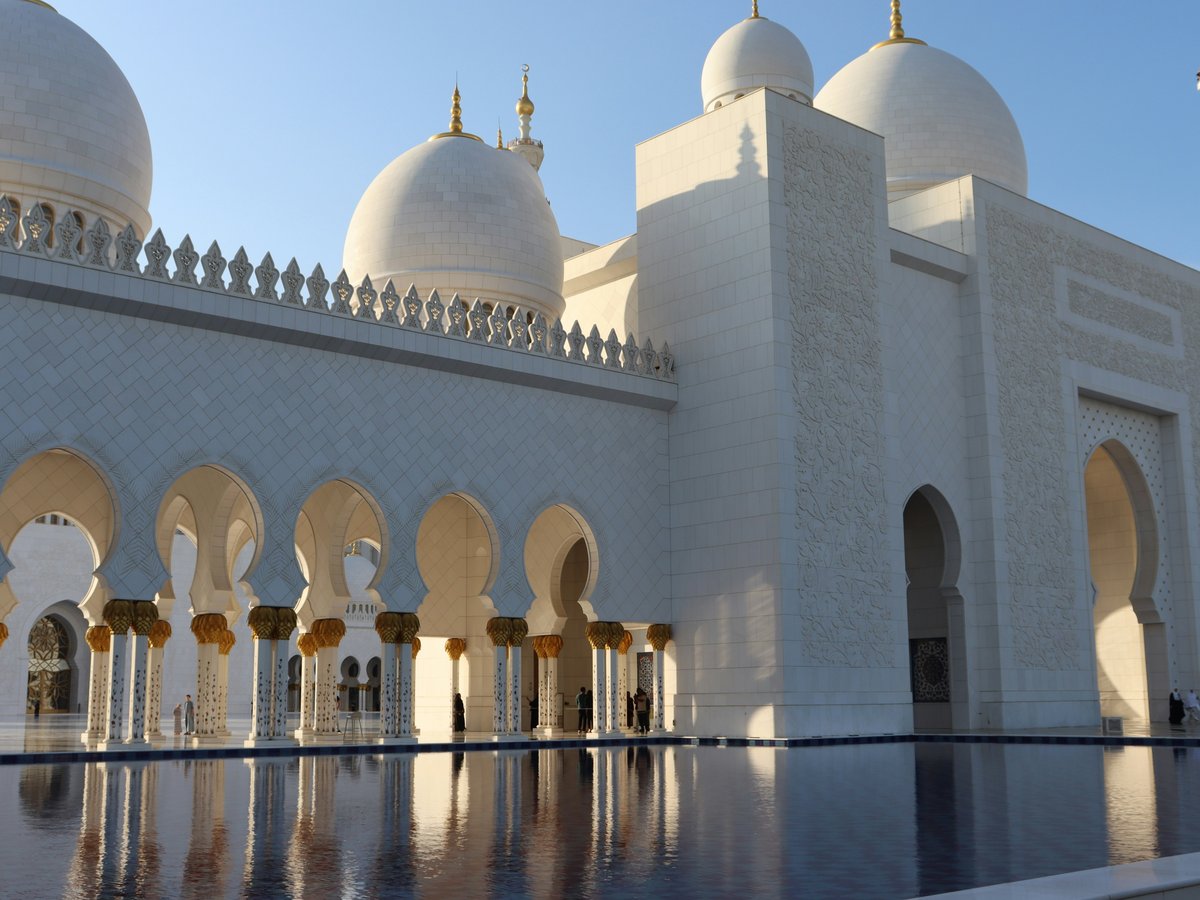 a large white building with many arches and domes
