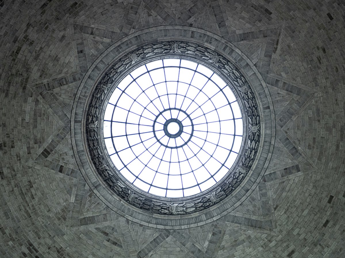 a circular window in the ceiling of a building