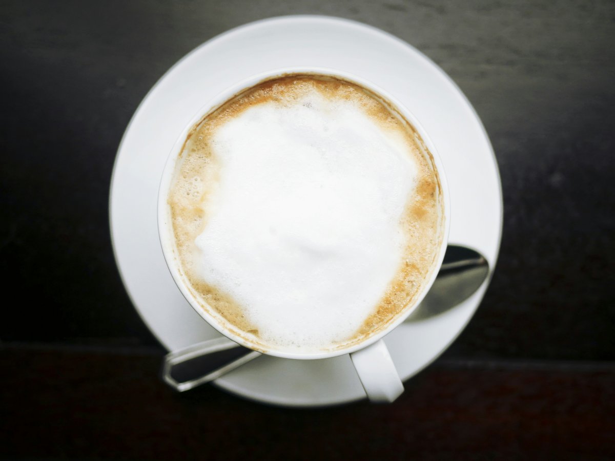 white ceramic cup with coffee