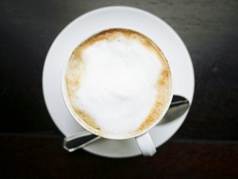 white ceramic cup with coffee