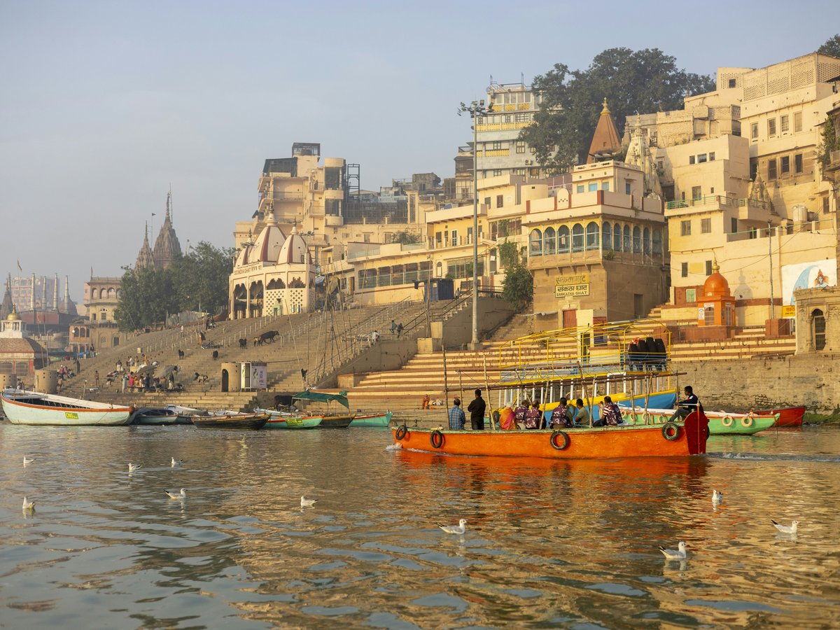 a group of boats floating on top of a river