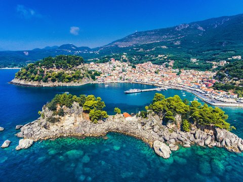 aerial view of green trees and blue sea during daytime
