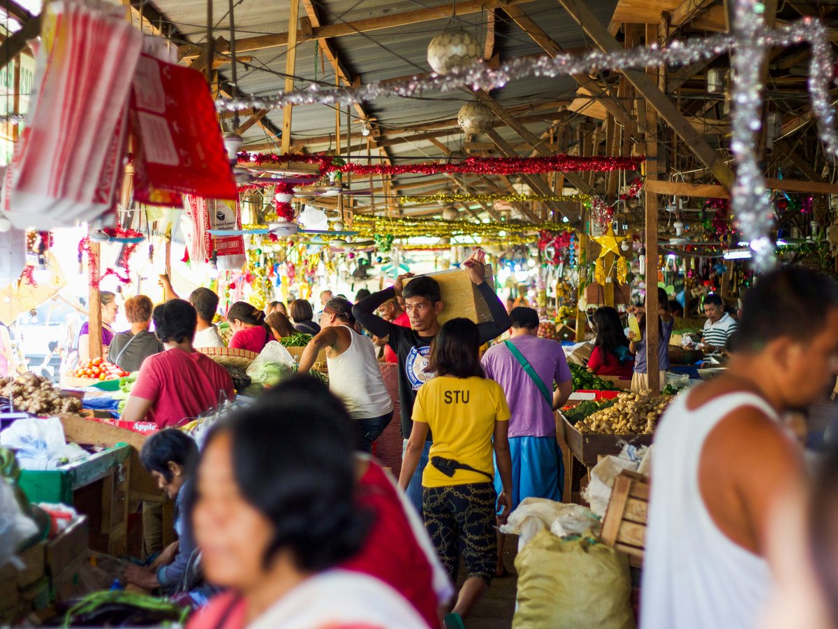 people in a market during daytime
