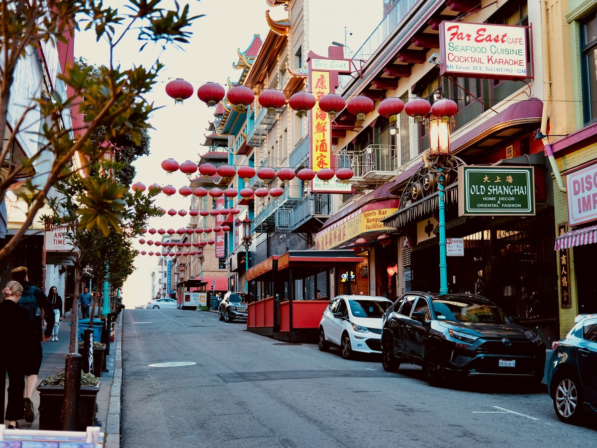 a street with cars and buildings on either side of it
